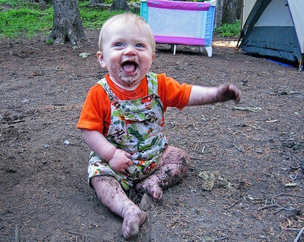 baby playing in dirt
