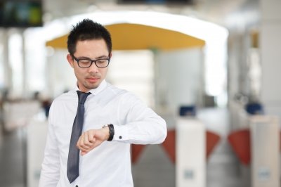 Man looks at watch